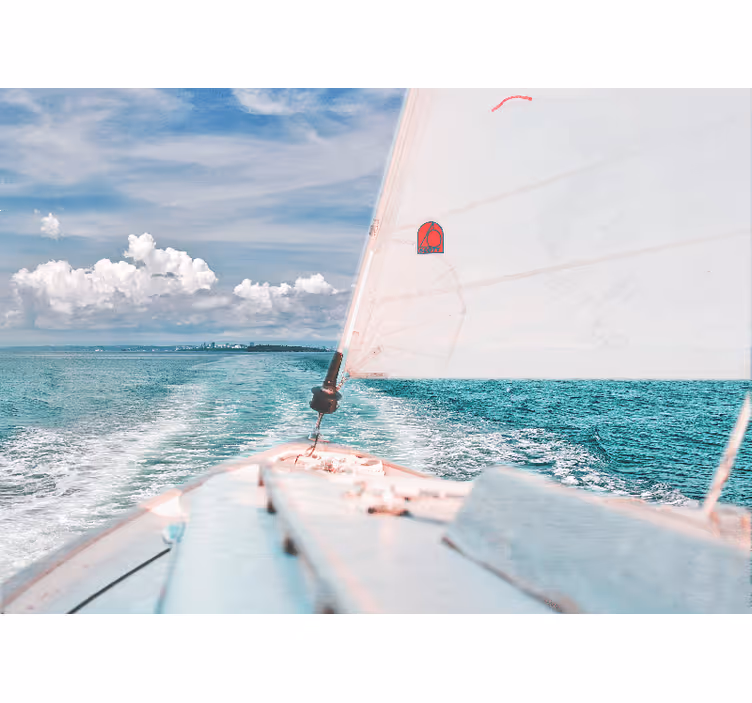 Wall mural blue boat at sea with white clouds - TenStickers